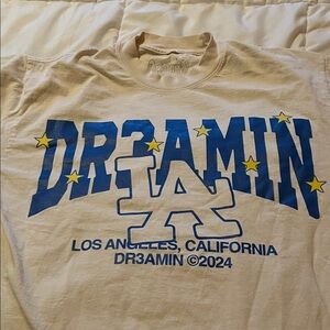 Clix Cream Graphic Tee with Blue and Yellow Design Los Angeles